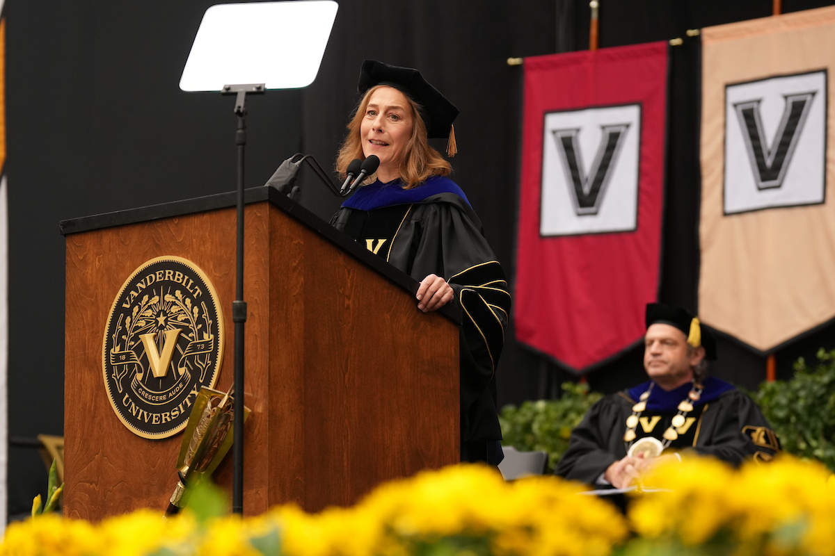 Provost C. Cybele Raver addresses the audience during commencement from a podium